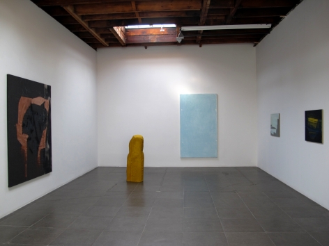 Installation of the art exhibition "Heat Waves" with 4 paintings on white walls and a yellow aqua resin sculpture