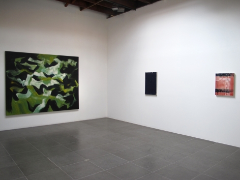 Installation of the art exhibition "Heat Waves" with 3 paintings on white walls