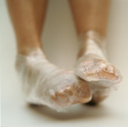 Pieds Bandés_2000_color photograph of two feet wrapped in saran wrap_29 1/2 x 29 1/2 inches (74.9 x 74.9 cm)