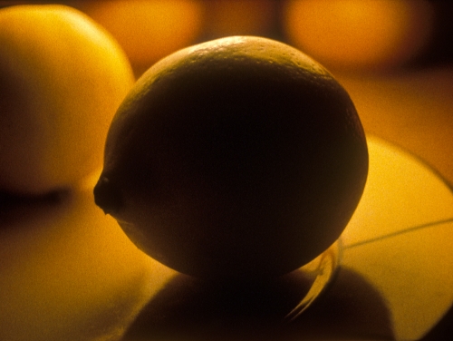 Close up image of a lemon in a shadow
