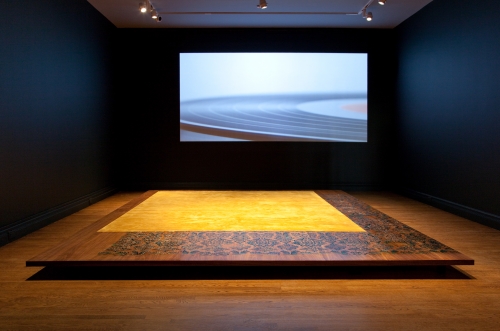 Floating Memories, 2009, silk rug, wood platform with walnut veneer, resin, loudspeakers, video projection